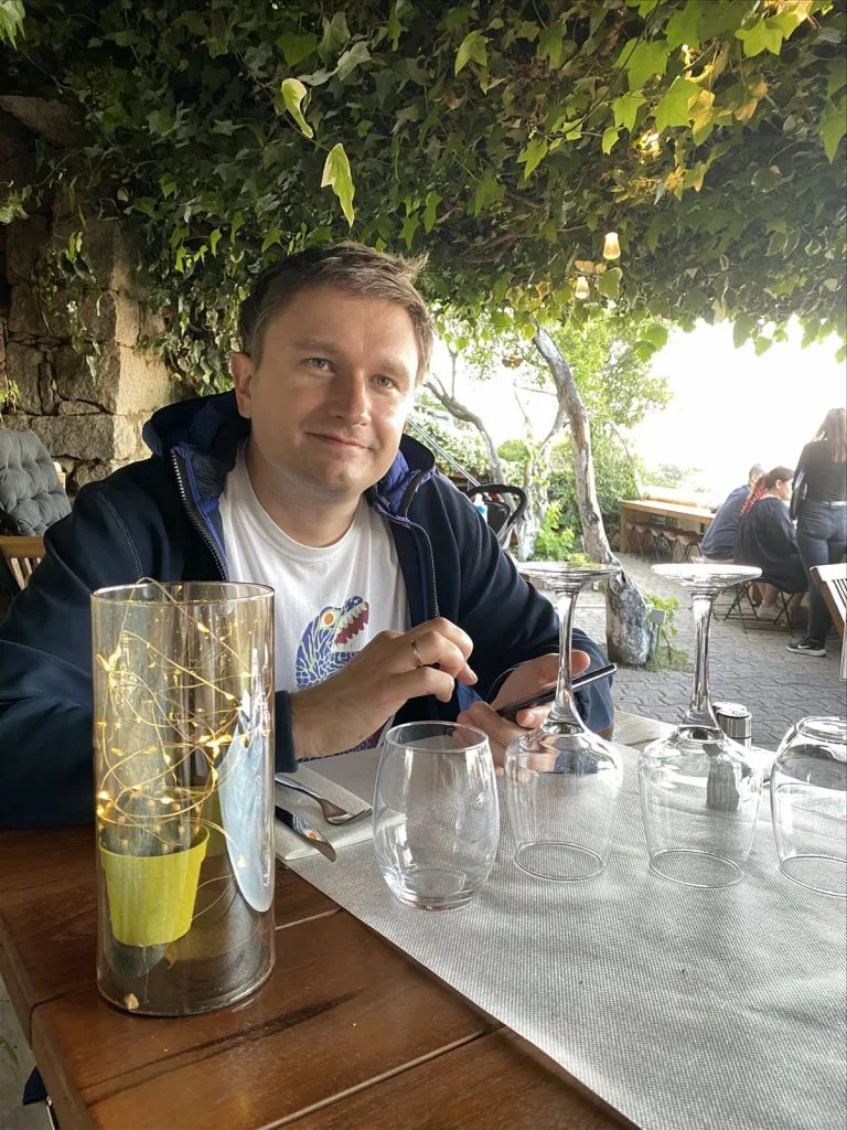 Man at a bar with a cocktail in Corsica