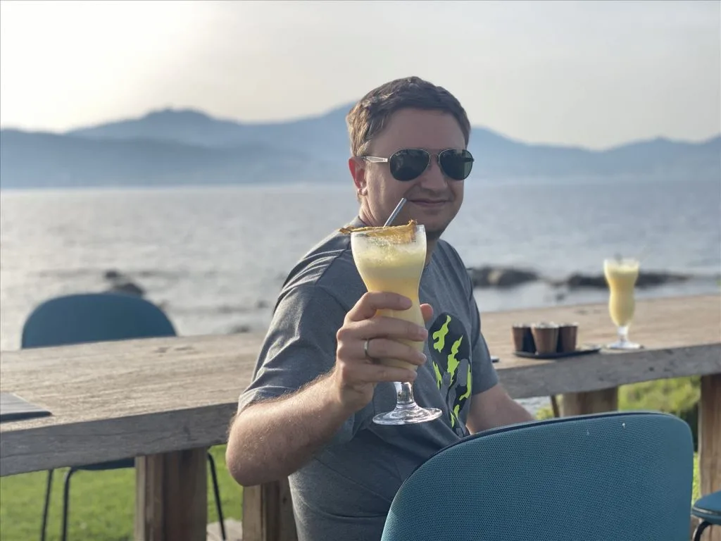 Man with a glass on villa terrace