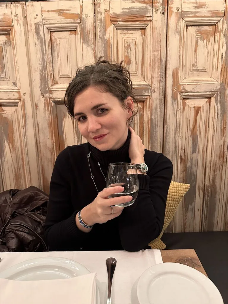 Girl with a glass of wine in a restaurant