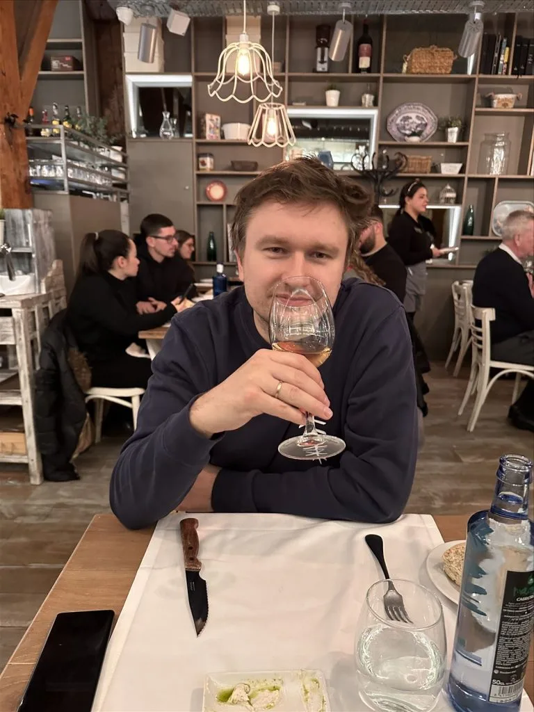 Man with champagne in a cafe
