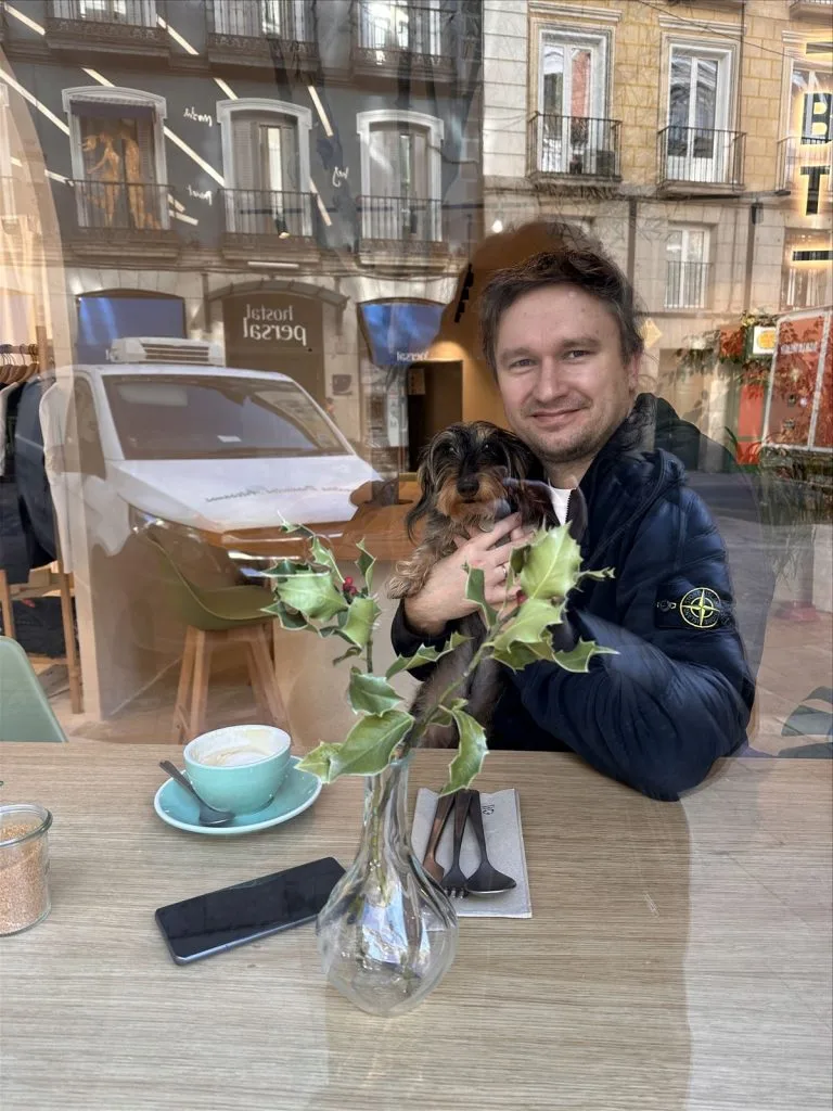 Man with drink at cafe table