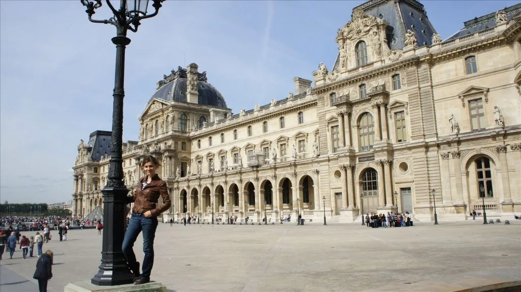 Louvre courtyard with pyramid during the day