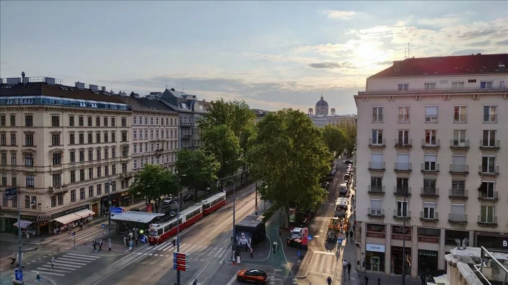 Tram on a Vienna street by historic buildings
