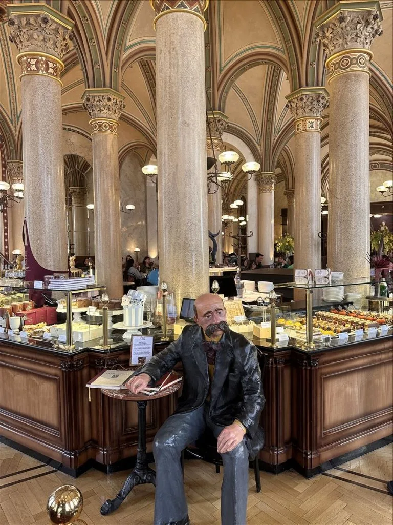 Man at Vienna pastry shop window