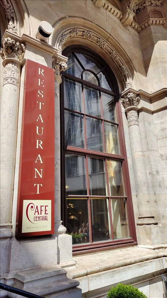 Facade of a restaurant with red sign in Vienna