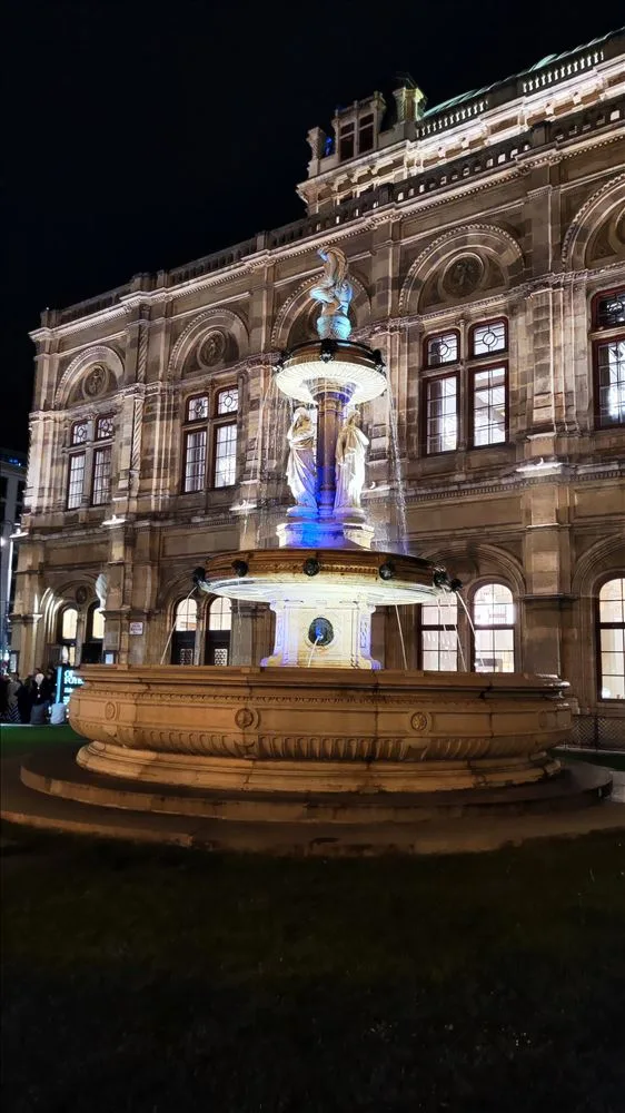 Fountain in front of the Vienna Opera with lighting